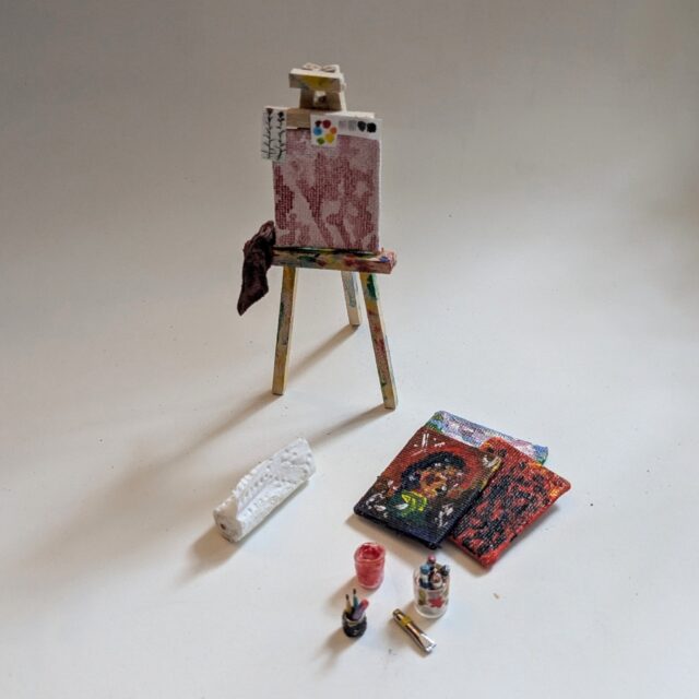 🏡 Okay I think this actually the first thing that I made for my dollhouse. This easel was made from basal wood sticks. The canvases are cardboard covered with a tightly woven fabric. I prepped and painted them like I would have a real painting and there is even an underpainting on display on the easel. The rag is a scrap from my actual paint rag (which is an old t-shirt), and the paper towels are just that. 
⭐BONUS⭐ The last picture is an incredible knitting and sewing basket that my beautiful mother made me at the start of my project! She even knit a tiny item for it 🥹 I believe she used half a styrofoam ball for the base. Now you see my love for miniatures is genetic!

#dollhouse #dollhousemakeover #miniatures #dollhousedecor #upcycle #handmadecrafts #dıy #montanaartist